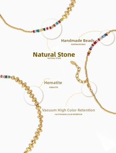 Detail view of handmade natural stone beads and 18k gold vacuum plated hematite necklace