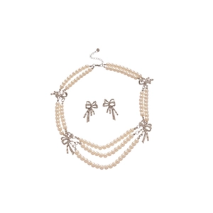 Sparkling diamond bow and pearl multi-layer jewelry set with necklace and earrings