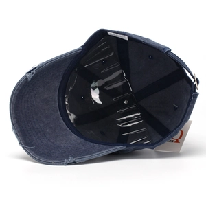 Navy blue washed cotton baseball cap with vintage distressed details and adjustable strap