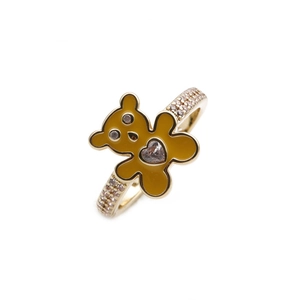 Detail of gold-plated bear ring with yellow enamel and heart-shaped cubic zirconia