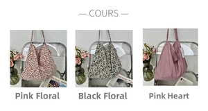 Detailed close-up showing pink floral, black micro-floral and pink heart pattern tote bags