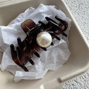 French vintage tortoise shell hair claw clip with large pearl accent in a beige gift box