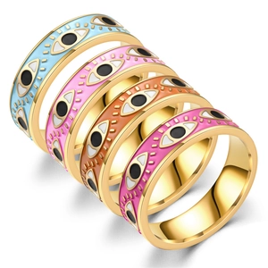 Set of four colorful Evil Eye titanium steel rings with gold finish and enamel detail