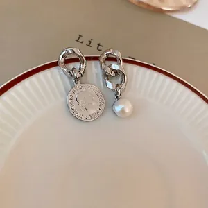 Asymmetric silver chain earrings with vintage coin pendant and white round pearl detail