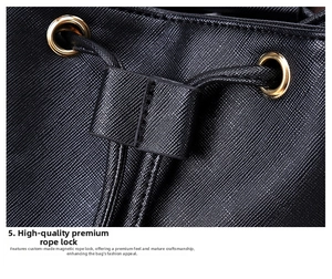 Detail of high-quality golden metal eyelets and drawstring closure on black Saffiano bag