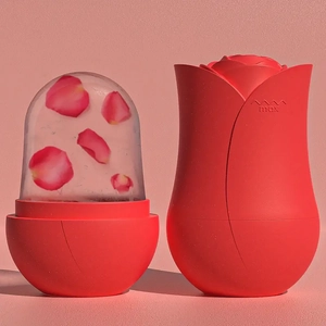 Detail showing red rose shaped silicone ice facial roller with frozen rose petal core