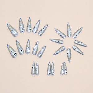 Long stiletto press-on nails featuring silver grey base with spooky cartoon ghost patterns