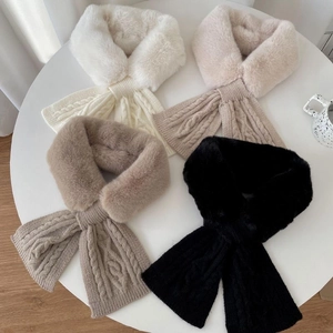 Detail of plush faux fur and cable knit texture in white beige coffee and black