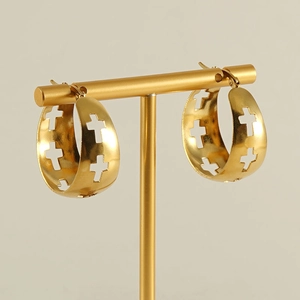 Golden stainless steel hoop earrings with cutout cross pattern on a display stand