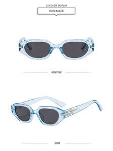 Detail view of light blue transparent frames and dark grey lenses of retro sunglasses