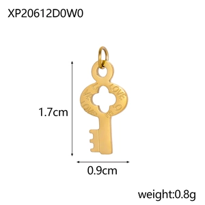 Macro view of a 1.7cm golden stainless steel key pendant with LOVE engraving detail
