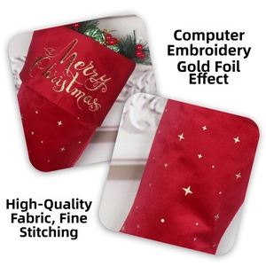 Detail of red velvet Christmas stocking with gold Merry Christmas embroidery and stars