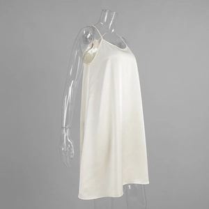 Side view of white satin slip dress featuring fine straps and a delicate V-neckline