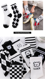 Detail showing mid-calf cotton socks with bear prints, argyle, and checkerboard patterns