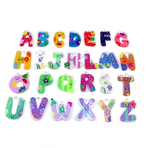Set of 26 colorful acrylic English letter pendants with various cartoon graffiti patterns