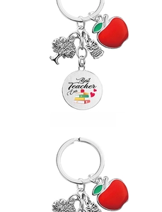 Detail of metal teacher keychain with apple tree owl charms and Best Teacher Ever engraving