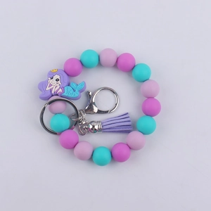 Detail of mermaid silicone beaded keychain with purple tassel and lobster clasp
