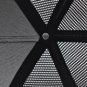 Macro detail of baseball cap interior with reinforced tape, metal rivet and mesh fabric