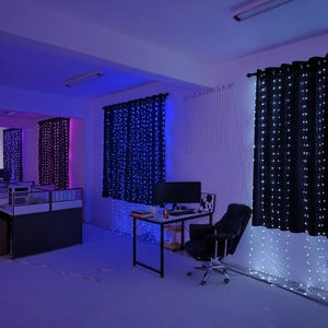 Detail of LED curtain lights showing blue, white and purple colors in a modern office setup