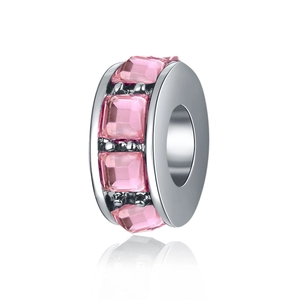 Detailed macro view of a silver bead charm featuring square-cut pink zircon stones