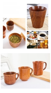 Detailed view of handmade wooden tea cups with natural grain patterns and ergonomic handles