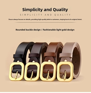Detail view of thin genuine leather belts in four colors with light gold metal buckles
