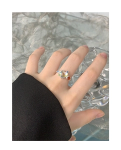 Detail of S925 silver ring featuring heart moonstone and colorful zircon on a model