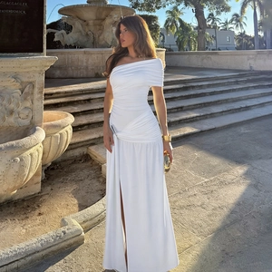 Elegant white one-shoulder maxi dress with side slit and gathered ruched detailing