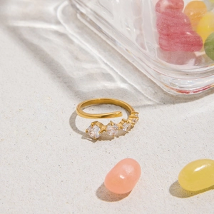 Elegant gold-plated stainless steel open ring featuring four sparkling round zircons