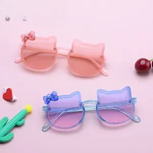Detail of glitter cat-ear sunglasses with bow accent and UV protection for kids