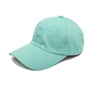 Close-up of mint green cotton baseball cap with six-panel design and curved brim detail