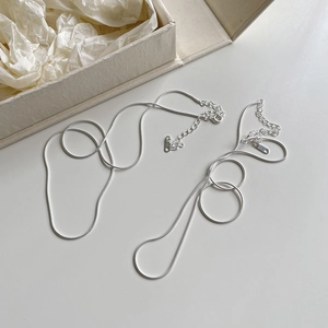 Classic 925 sterling silver thin snake bone chain necklace on minimalist display