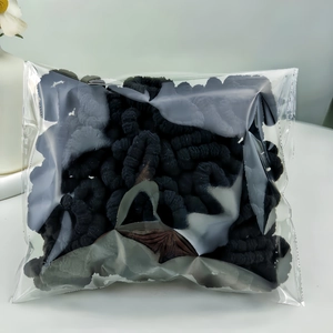 Detail of multi-pack colorful elastic hair bands for babies in a clear sealed bag