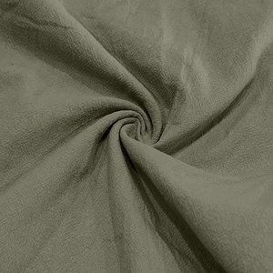 Close-up of greyish-green linen fabric texture showing detailed weave and soft fiber