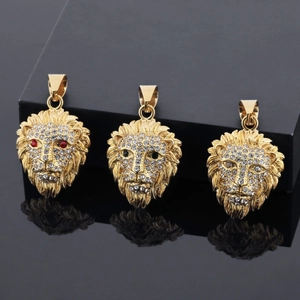 Macro view of gold-plated lion head pendant necklaces set with sparkling crystals
