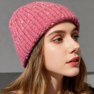Pink tweed knit beanie hat with colorful dots for women in elegant winter style