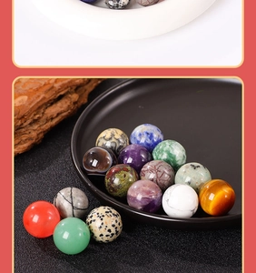 Macro shot of 20mm natural crystal spheres like amethyst and agate on black tray