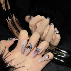 Gothic press-on nails with black spiders and silver rhinestones on ombre stiletto shape