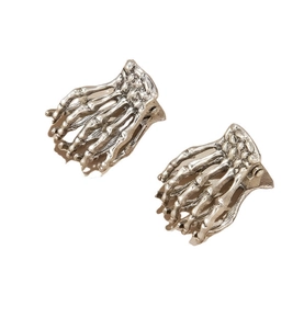 Close-up of retro silver skeleton hand hair clips with gothic punk style bone details