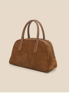 Brown suede bowling bag with leather handles and shell shape for elegant women