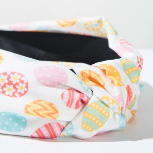 Detail of Easter knotted headband with colorful egg prints and durable black fabric lining