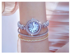 Detailed close-up of luxurious silver rhinestone watch with sparkling crystal bracelets