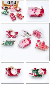 Detail of Christmas acrylic hair claws with glitter reindeer and gingerbread man motifs