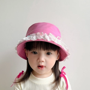 Pink cotton children's bucket hat with white lace, pearl accents and chin strap