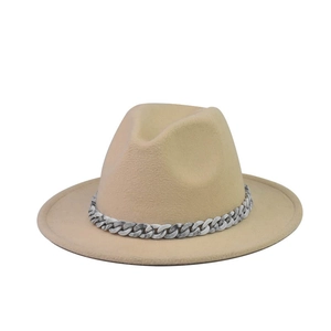 Detailed texture of beige wool fedora featuring a stylish grey marble acrylic chain link
