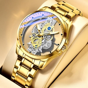 Macro shot of gold mechanical skeleton watch showing gears and stainless steel strap