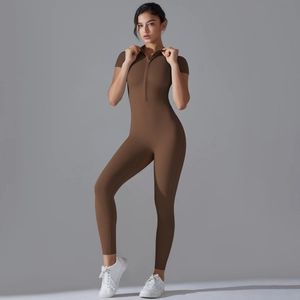 Close-up of chocolate brown yoga bodysuit with stand collar zipper and short sleeves