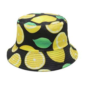 Close-up of lemon print detail and reinforced stitching on black cotton bucket hat
