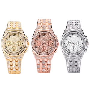 Luxury iced-out quartz watch set in gold, rose gold and silver with Roman numerals