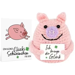 Handmade pink crochet pig plush doll with motivational card on a clean white background